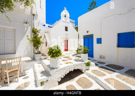 Square with church on whitewashed street with typical Greek architecture in beautiful Mykonos town, Cyclades islands, Greece Stock Photo