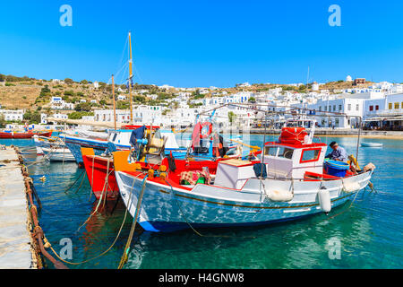 MYKONOS PORT, GREECE - MAY 16, 2016: Fishing boats anchoring in Mykonos port, Cyclades islands, Greece. Stock Photo