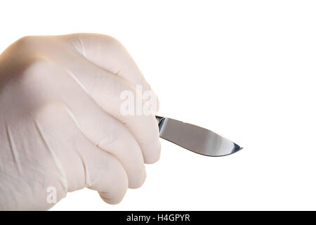 Medical scalpel in hand on white background isolated Stock Photo