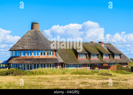 Typical guest house and restaurant with thatched roof t in Kampen village on western coast of Sylt island, Germany Stock Photo