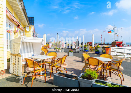 SYLT ISLAND, GERMANY - SEP 6, 2016: restaurant tables in List port on northern coast of Sylt island, Germany. Stock Photo