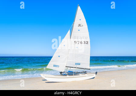 SYLT ISLAND, GERMANY - SEP 9, 2016: Sailing boat on Kampen beach, Sylt island, Germany. Stock Photo