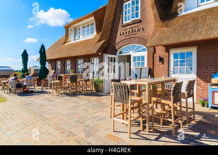 SYLT ISLAND, GERMANY - SEP 11, 2016: chairs and tables on terrace in typical Frisian restaurant which is located near Morsum cli Stock Photo