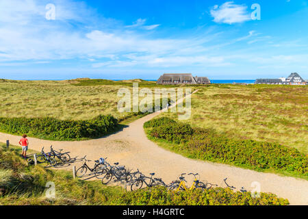 SYLT ISLAND, GERMANY - SEP 11, 2016: Bikes parked on coastal path in Kampen village on western coast of Sylt island, Germany. Stock Photo