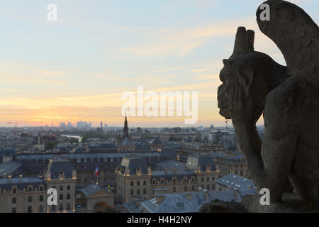 The Chimeras of Notre Dame watching the sunset in Paris Stock Photo