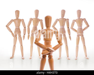 Wooden dummy characters. Head and his team, team leader, hierarchy or leadership concept Stock Photo