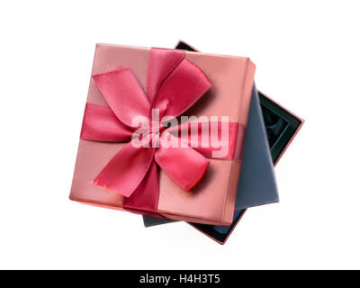 Gift boxes, black one nesting in the brown one with gift ribbon. Isolated on white with clipping path Stock Photo