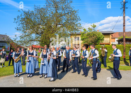 GLASING VILLAGE, AUSTRIA - APR 30, 2016: music band people preparing for a parade during May Tree celebration. In Germany and Au Stock Photo