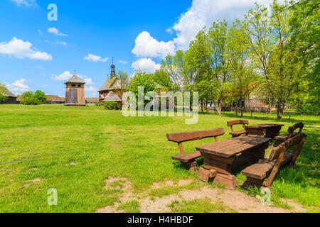 Picnic table on green meadow in Tokarnia village, Poland Stock Photo