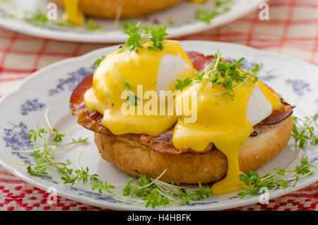 Eggs benedict, prosciutto topped with Hollandaise sauce Stock Photo