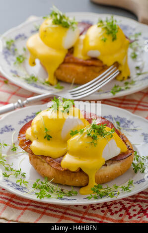 Eggs benedict, prosciutto topped with Hollandaise sauce Stock Photo