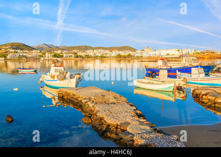 Fishing boats mooring in Naoussa port at sunrise time, Paros island, Cyclades, Greece Stock Photo