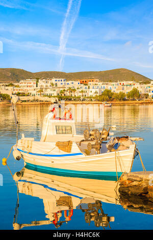 Fishing boat mooring in Naoussa port at sunrise time, Paros island, Cyclades, Greece Stock Photo