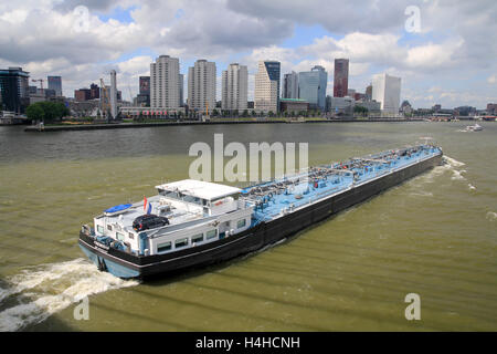 Rotterdam, the Netherlands - July 13, 2013: river barge passing Rotterdam, the Netherlands Stock Photo