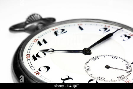 Old swiss pocket watch very close up perspective left isolated on white background Stock Photo