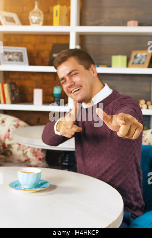 Young man smiling and pointing at you with both hands Stock Photo