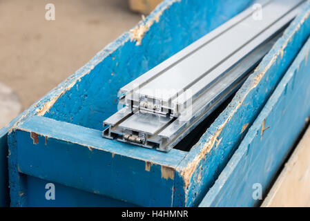 the aluminum structural parts in wooden box Stock Photo