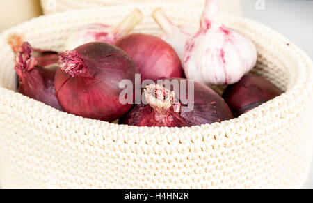 the red onions in a wicker basket close-up Stock Photo