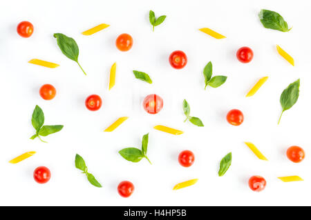 Italian food pattern with red tomatoes, pasta, basil leafs isolated on white background Stock Photo