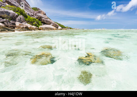 Turquoise water and coral reefs at Anse Source D'Argent in La Digue, Seychelles Stock Photo