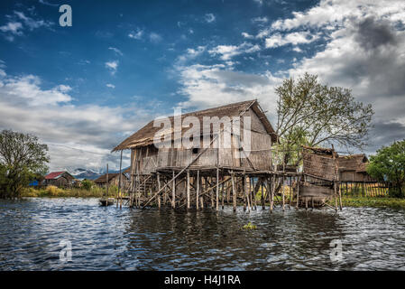 Wooden houses on piles inhabited by the tribe of Inthar, Inle Lake, Myanmar Stock Photo