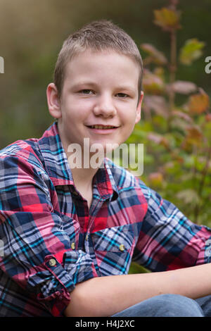 Fall portrait of happy young boy outdoors Stock Photo