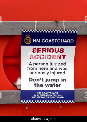 HM Coastguard Notice Serious Accident Don't jump in the water on Tate Pier Whitby Harbour Stock Photo