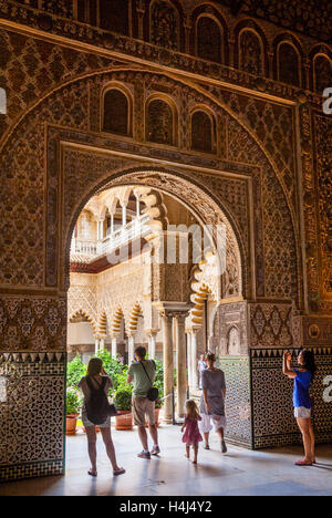 Spain, Andalusia, Province of Seville, Seville, Alcazar, tourists admire the view into the Courtyard of the Maidens Stock Photo