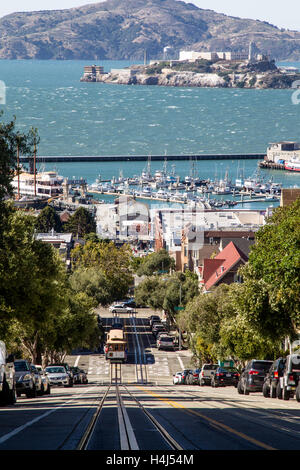 Cable Car on Hyde Street with Alcatraz Island in the background in San Francisco, California, USA. Stock Photo