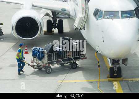 FRANKFURT, GERMANY - MAY 22, 2016: A Boeing 737 from UIA airline is being loaded luggage on the plane and prepared for its next Stock Photo