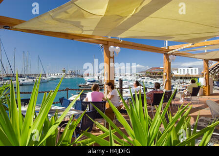 LANZAROTE ALFRESCO Waterside restaurant in Marina Rubicon with people enjoying sea views and restaurants alfresco meal, Lanzarote Canary Islands Spain Stock Photo
