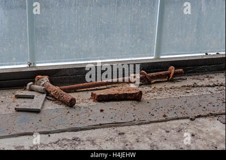 Rusty objects on dirty window sill Stock Photo