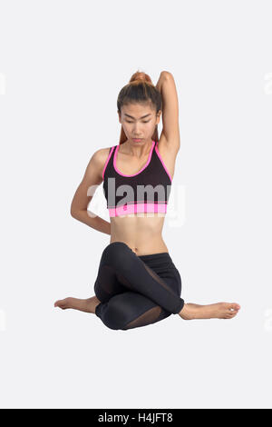 Young Woman In Sports Bra On Yoga Pose On Isolated White