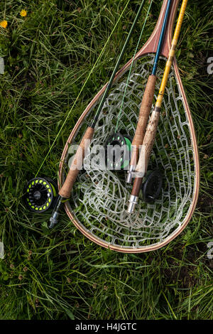 WY01058-00...WYOMING - Fishing rods and net along Brooks Lake Creek near Dubois. Stock Photo