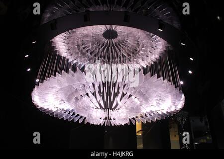 MILAN, ITALY - APRIL 15 2015: Huge pendant glass chandelier in Milan during the milanese design week Stock Photo