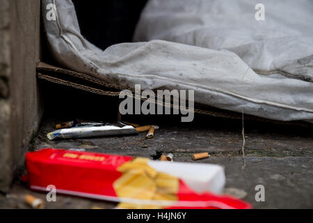 The belongings of a rough sleeper left in a doorway Stock Photo