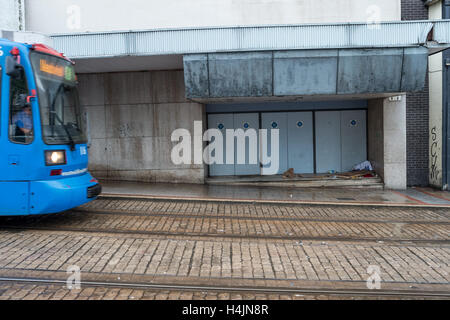 The belongings of a rough sleeper left in a doorway Stock Photo