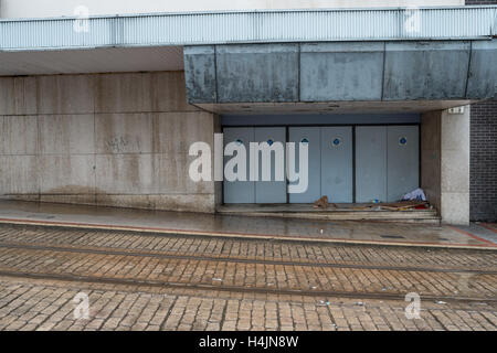 The belongings of a rough sleeper left in a doorway Stock Photo