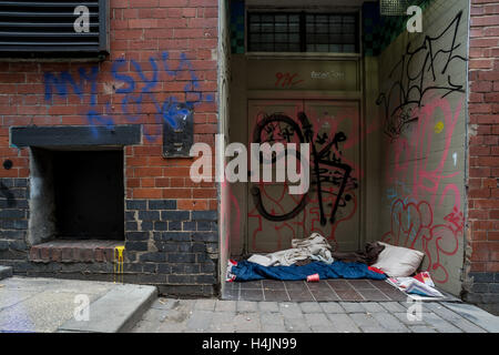 The belongings of a rough sleeper left in a doorway Stock Photo