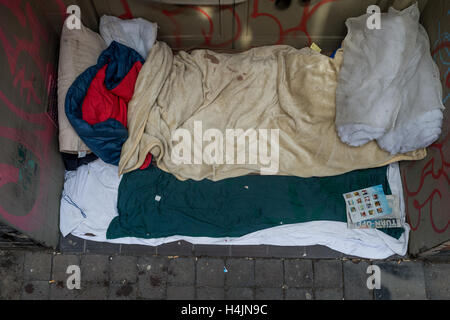 The belongings of a rough sleeper left in a doorway Stock Photo