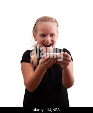 Little girl holding a smart phone against white background Stock Photo