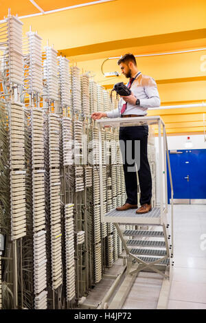 Technician using digital cable analyzer Stock Photo