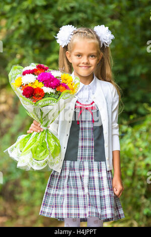 Portrait of a seven-year first-grade girls going to school on September 1 in Stock Photo