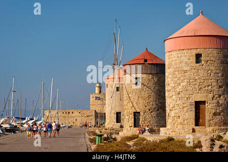 Old windmills at Rhodes city harbour, Island of Rhodes, Dodecanese island group, Greece. Stock Photo