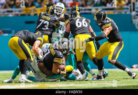 Miami Gardens, Florida, USA. 16th Oct, 2016. Pittsburgh Steelers quarterback Ben Roethlisberger (7), is sacked by Miami Dolphins defensive end Andre Branch (50), and Miami Dolphins defensive end Cameron Wake (91), during second half action of their NFL game Sunday October 15, 2016 at Hard Rock Stadium in Miami Gardens. © Bill Ingram/The Palm Beach Post/ZUMA Wire/Alamy Live News Stock Photo