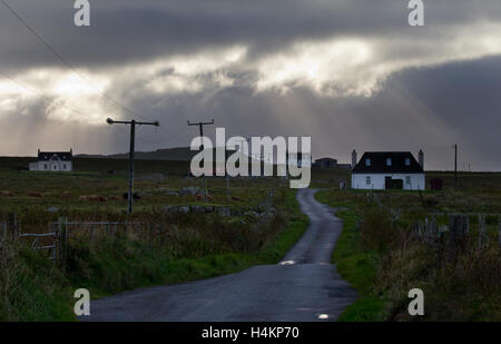 stormy sky on road with cottages and landscape of Tiree,Inner Hebrides,Argyll and Bute,Scotland Stock Photo