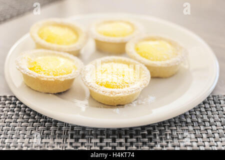 Fresh mini cakes with yellow filling foe dessert time Stock Photo