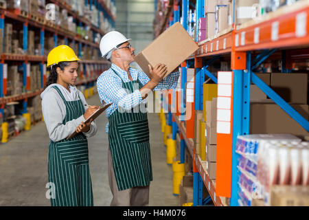 Warehouse workers checking the inventory Stock Photo