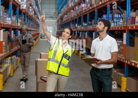 Male and female worker checking inventory Stock Photo