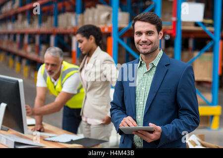 Portrait of manager using digital table Stock Photo